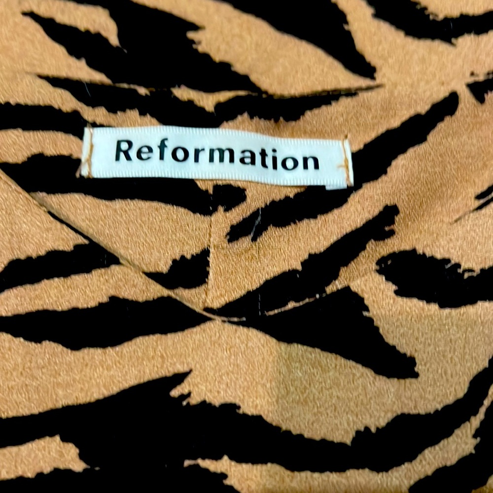 Reformation’s classic Crimini midi slip dress in tiger print.